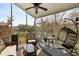 Relax on the screened porch with comfortable seating and views of the surrounding landscape at 3558 Stockton Dr, Mount Pleasant, SC 29466