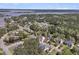 Aerial view of neighborhood homes surrounded by lush trees, ponds and landscaping at 3734 St Ellens Dr, Mount Pleasant, SC 29466