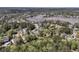 Picturesque aerial view of waterfront community, showcasing homes nestled among trees near water at 3734 St Ellens Dr, Mount Pleasant, SC 29466