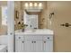 Stylish bathroom with white cabinets, a modern mirror, and bronze hardware in a cozy and well-lit setting at 3734 St Ellens Dr, Mount Pleasant, SC 29466