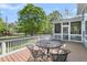 Outdoor deck features outdoor furniture and a view of the trees at 3734 St Ellens Dr, Mount Pleasant, SC 29466