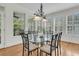 Dining room showcasing a glass table surrounded by lots of natural light and hardwood flooring at 3734 St Ellens Dr, Mount Pleasant, SC 29466