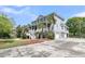 Lovely two-story home with an elevated porch, three-car garage and beautifully landscaped yard at 3734 St Ellens Dr, Mount Pleasant, SC 29466