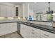Kitchen showcasing custom cabinetry, granite countertops, stainless steel dishwasher and a breakfast bar area at 3734 St Ellens Dr, Mount Pleasant, SC 29466