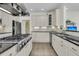 Modern kitchen featuring stainless appliances, stone tile backsplash, and granite countertops, perfect for cooking at 3734 St Ellens Dr, Mount Pleasant, SC 29466