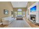 Bright living room with vaulted ceiling, stone fireplace, built-in cabinets, and large windows for natural light at 3734 St Ellens Dr, Mount Pleasant, SC 29466