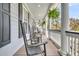Comfortable porch with rocking chairs and lush hanging plants at 3734 St Ellens Dr, Mount Pleasant, SC 29466