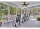 Spacious screened porch with rocking chairs overlooking a scenic view of the trees at 3734 St Ellens Dr, Mount Pleasant, SC 29466
