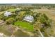 Beautiful aerial view of home and other homes near the marsh with a wooden walkway at 377 Lofton Ct, McClellanville, SC 29458