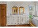 Elegant bathroom with double vanity, marble countertop, and ample storage, designed for modern comfort and style at 377 Lofton Ct, McClellanville, SC 29458