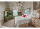 Bright bedroom boasts vaulted ceilings, a built-in green cabinet, and a comfortable bed at 377 Lofton Ct, McClellanville, SC 29458