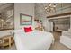 A serene bedroom featuring a large bed, wooden nightstand and vaulted ceilings at 377 Lofton Ct, McClellanville, SC 29458