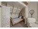 Cozy bedroom nook with wicker furniture, including a bed and a chair at 377 Lofton Ct, McClellanville, SC 29458