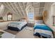Cozy bedroom featuring twin beds and ample natural light, creating a welcoming and comfortable space for guests at 377 Lofton Ct, McClellanville, SC 29458