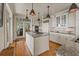 Beautiful kitchen with a center island, granite countertops, and modern appliances, perfect for cooking and entertaining at 377 Lofton Ct, McClellanville, SC 29458