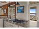 Gourmet kitchen with granite countertops and professional-grade gas cooktop, perfect for culinary enthusiasts at 377 Lofton Ct, McClellanville, SC 29458