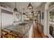 Well-equipped kitchen with a large island, granite countertops, and seamless transition to the living area at 377 Lofton Ct, McClellanville, SC 29458