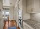 Bright kitchen featuring stainless steel appliances, custom cabinetry, and a cozy breakfast nook with water views at 377 Lofton Ct, McClellanville, SC 29458