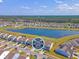 Beautiful aerial view of a Primary planned community with a central pond and tree lined backdrop at 400 Dunlin Dr, Summerville, SC 29486
