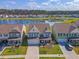 A beautiful aerial view of this two-story home with a lake view and well-manicured lawn at 400 Dunlin Dr, Summerville, SC 29486