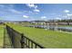 Scenic backyard view with a pond and houses lined up along the waterfront in a quiet neighborhood at 400 Dunlin Dr, Summerville, SC 29486