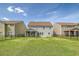 A spacious backyard with a view of neighboring homes and a well-maintained lawn at 400 Dunlin Dr, Summerville, SC 29486