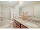 Bathroom with double vanity, granite countertops, and a tub-shower combination with tiled surround at 400 Dunlin Dr, Summerville, SC 29486