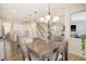 Open-concept dining area connects to the kitchen and a living room with stairs at 400 Dunlin Dr, Summerville, SC 29486