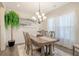 A well-lit dining room featuring a wooden table and chairs on a patterned rug at 400 Dunlin Dr, Summerville, SC 29486