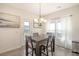 Dining area with a table, chairs, light fixture, and view to the backyard at 400 Dunlin Dr, Summerville, SC 29486