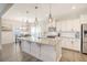 The kitchen has granite countertops, stainless steel appliances and a center island at 400 Dunlin Dr, Summerville, SC 29486