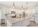Bright, modern kitchen with granite countertops, stainless steel appliances and pendant lighting at 400 Dunlin Dr, Summerville, SC 29486