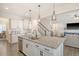 Bright kitchen featuring granite countertops, white cabinets, and stainless steel appliances at 400 Dunlin Dr, Summerville, SC 29486