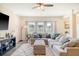 Cozy living room with a large sectional sofa, area rug, and lots of natural light at 400 Dunlin Dr, Summerville, SC 29486