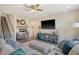 Bright living room with a ceiling fan, sofa, console, and decor at 400 Dunlin Dr, Summerville, SC 29486
