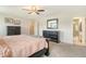 Bright main bedroom with carpeting, dark wood furniture, and ensuite bathroom with shower at 400 Dunlin Dr, Summerville, SC 29486