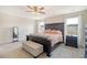 Spacious main bedroom featuring a decorative ceiling fan, a large bed and large windows at 400 Dunlin Dr, Summerville, SC 29486