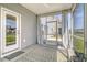 Cozy screened-in patio with outdoor rug, door, and curtains for privacy at 400 Dunlin Dr, Summerville, SC 29486