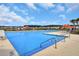 Large community pool featuring lounge chairs and umbrellas, perfect for relaxation and recreation at 400 Dunlin Dr, Summerville, SC 29486