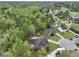 Stunning aerial perspective of a well-maintained home nestled among trees and a golf course at 4204 Magnolia Ct, North Charleston, SC 29420
