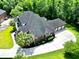 Expansive home featuring an attached three car garage and pristine landscaping at 4204 Magnolia Ct, North Charleston, SC 29420