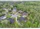 A high-angle shot capturing the layout of homes on a cul-de-sac, surrounded by dense, green forestry at 4204 Magnolia Ct, North Charleston, SC 29420