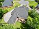 This aerial shot shows an attached deck, fenced yard, and large driveway at 4204 Magnolia Ct, North Charleston, SC 29420
