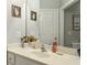 Well-lit bathroom vanity with neutral countertop, decorative accents, and framed artwork at 4204 Magnolia Ct, North Charleston, SC 29420
