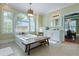 Bright primary bathroom features a large tub, vanity, and view into the bedroom at 4204 Magnolia Ct, North Charleston, SC 29420