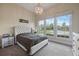 Bedroom with large windows allowing for lots of natural light and a beautiful chandelier at 4204 Magnolia Ct, North Charleston, SC 29420