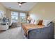 Bright bedroom featuring a bed, an office area and two windows at 4204 Magnolia Ct, North Charleston, SC 29420