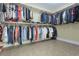 Large walk-in closet with ample hanging space and tiled floors at 4204 Magnolia Ct, North Charleston, SC 29420
