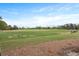 View of a well-maintained golf driving range with open green space on a sunny day at 4204 Magnolia Ct, North Charleston, SC 29420