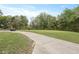 Picturesque view of a golf course with a winding path, mature trees, and lush green grass at 4204 Magnolia Ct, North Charleston, SC 29420